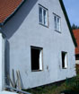 Das fertiggestellte Haus Steinbock, Demontage der verschlissenen Fenster.