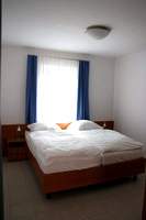 Baltic Sea Holiday Apartments Koelpinsee on the island Usedom. Bedroom.