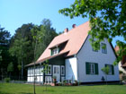 Das fertiggestellte Haus Steinbock, Wintergarten, Ansicht von außen.
